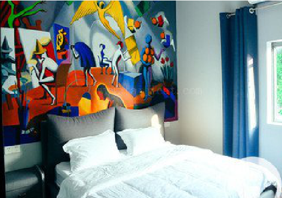 牟定对于酒店的墙体彩绘而言更注重哪些方面？